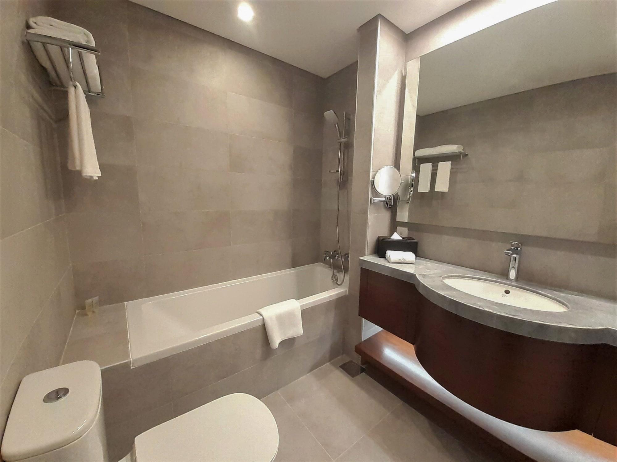 Somerset West Bay Doha Exterior photo Bathroom of a hotel room