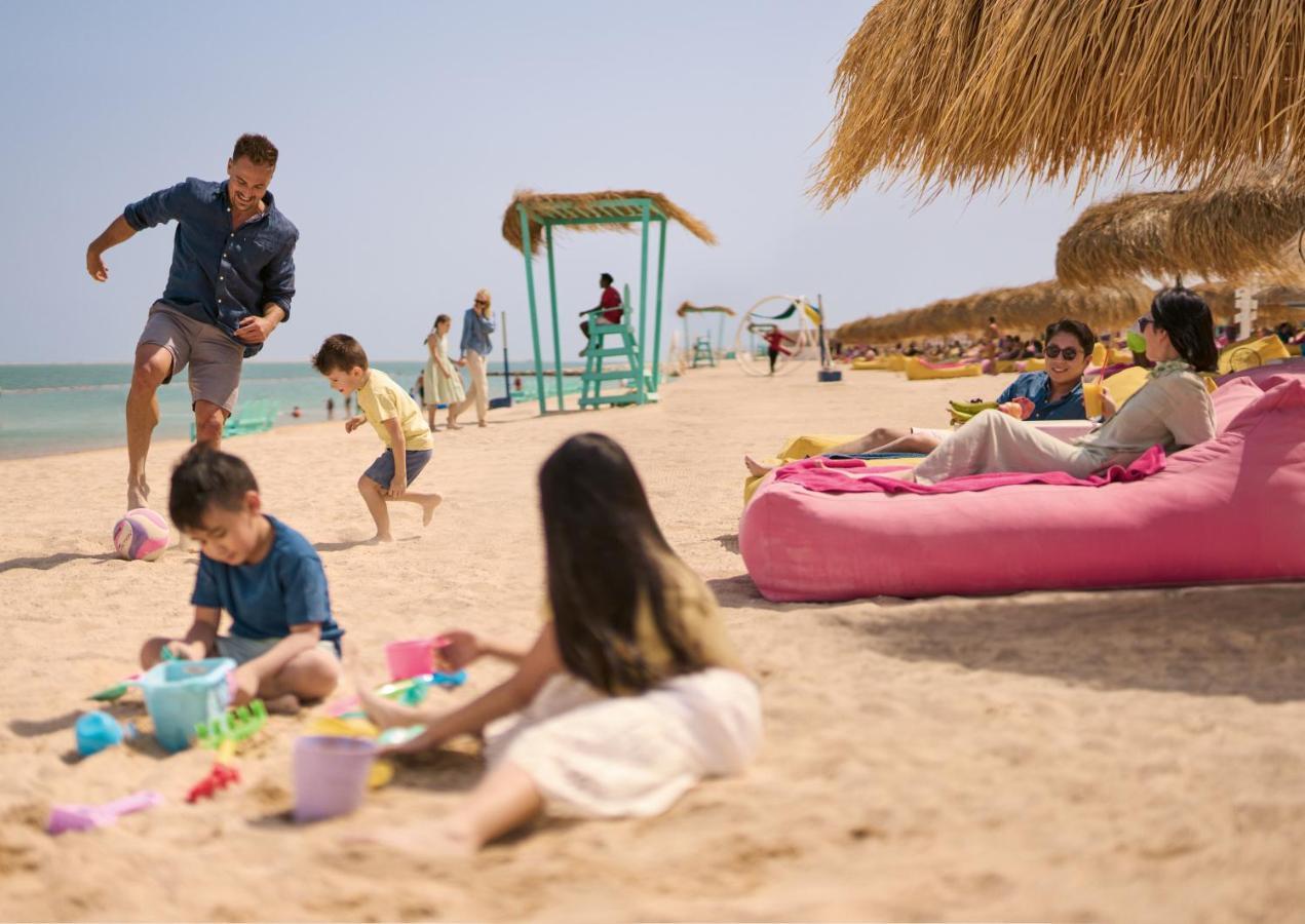 Somerset West Bay Doha Exterior photo Families at the beach