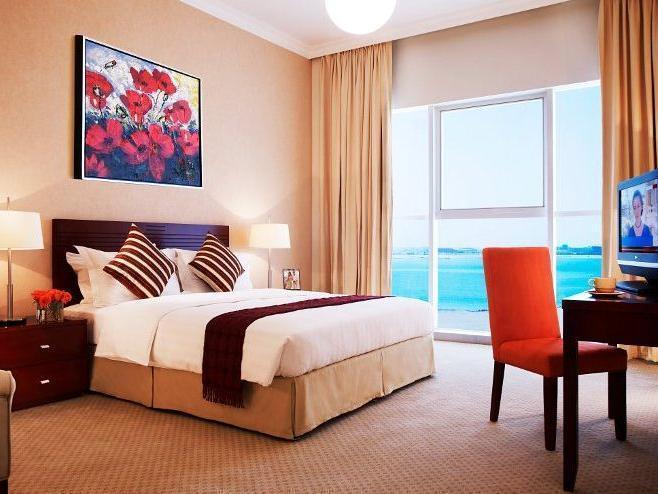Somerset West Bay Doha Exterior photo A bedroom in a hotel