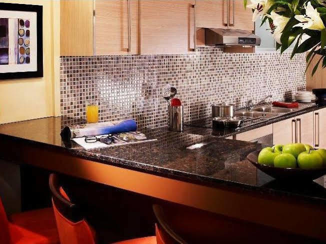 Somerset West Bay Doha Exterior photo A kitchen with granite countertops